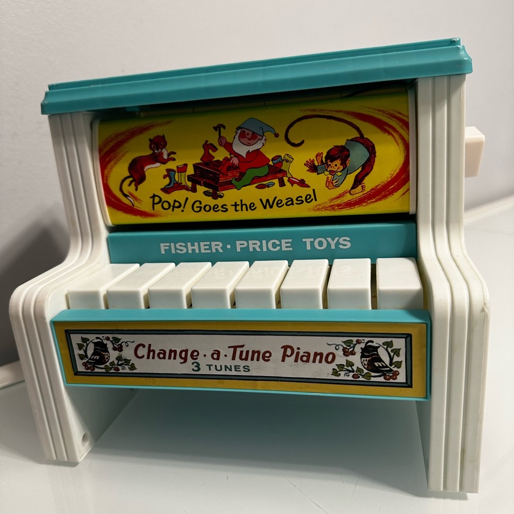 SOLD Vintage Fisher-Price Change-a-Tune Piano - Teal and White
